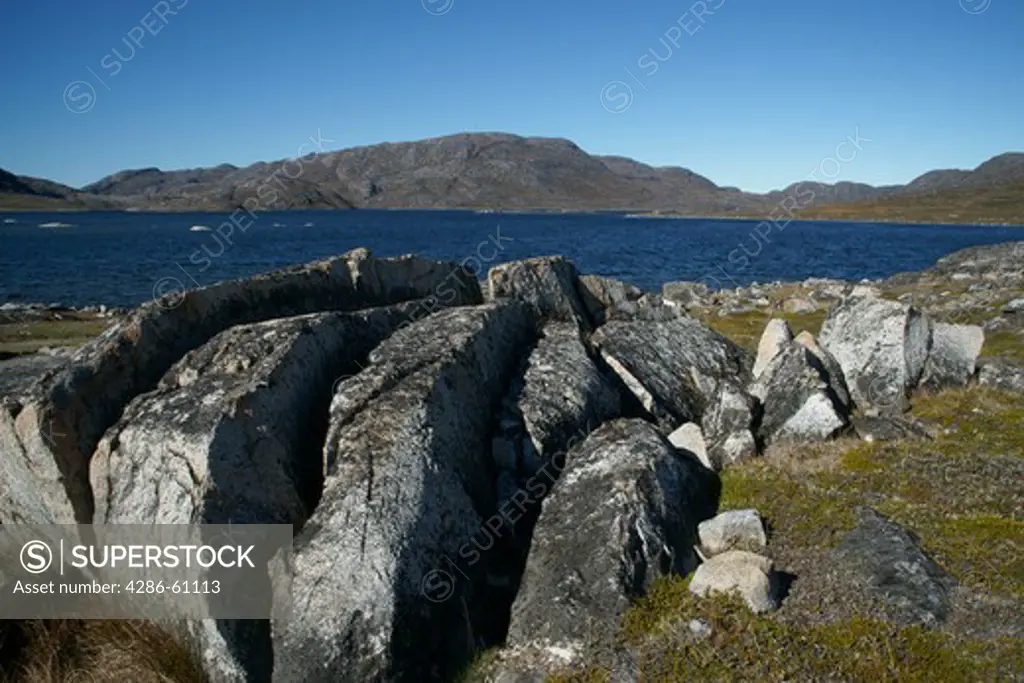 granite boulders overlooking Great Lake, Qaqortoq, Greenland (Danish name: Julianehab), largest town in South Greenland