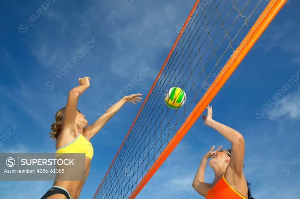women playing beach volleyball