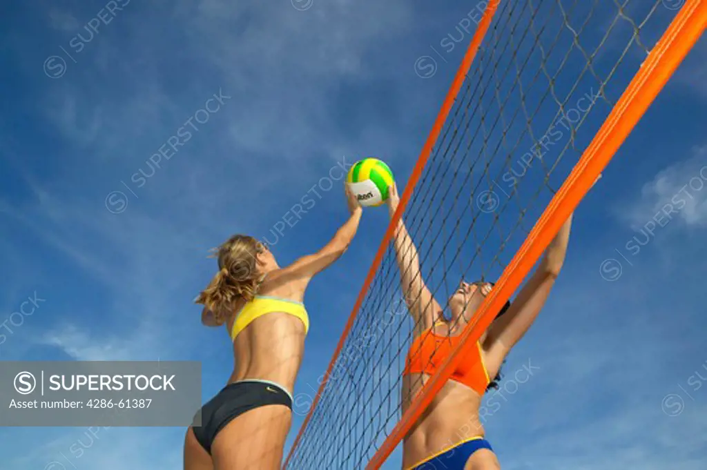 women playing beach volleyball