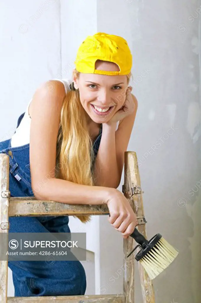 woman craftwoman having a break on ladder