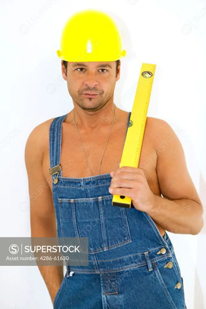 workman with hardhat and level