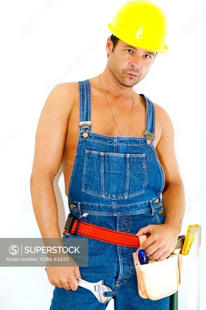 workman with hardhat wrench