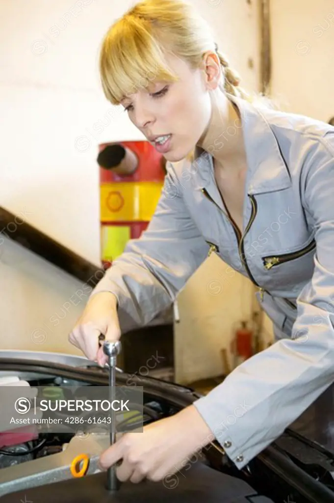 young female motor mechanic at a garage