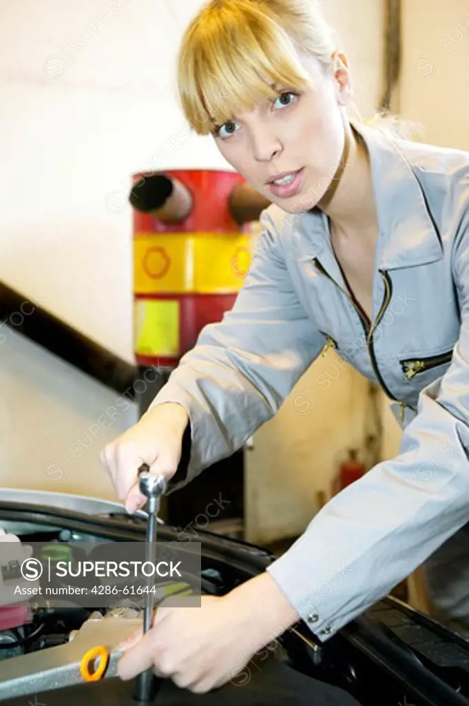 young female motor mechanic at a garage
