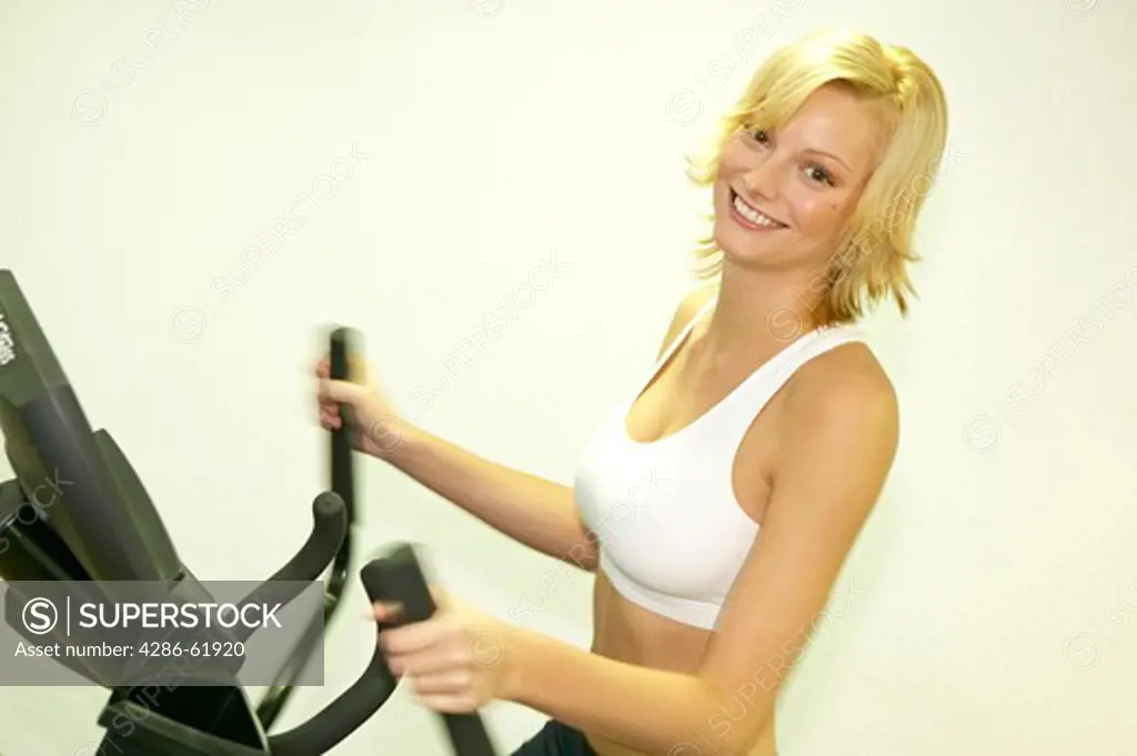 Young woman working out at the gym of a vital hotel