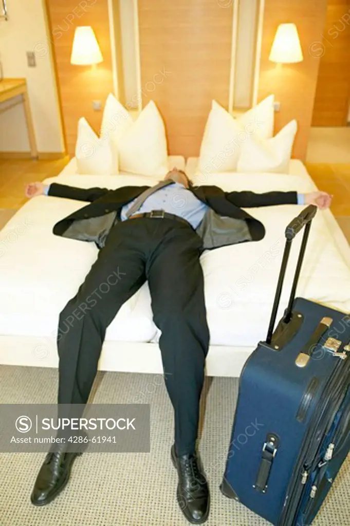tired man sleeping in hotel