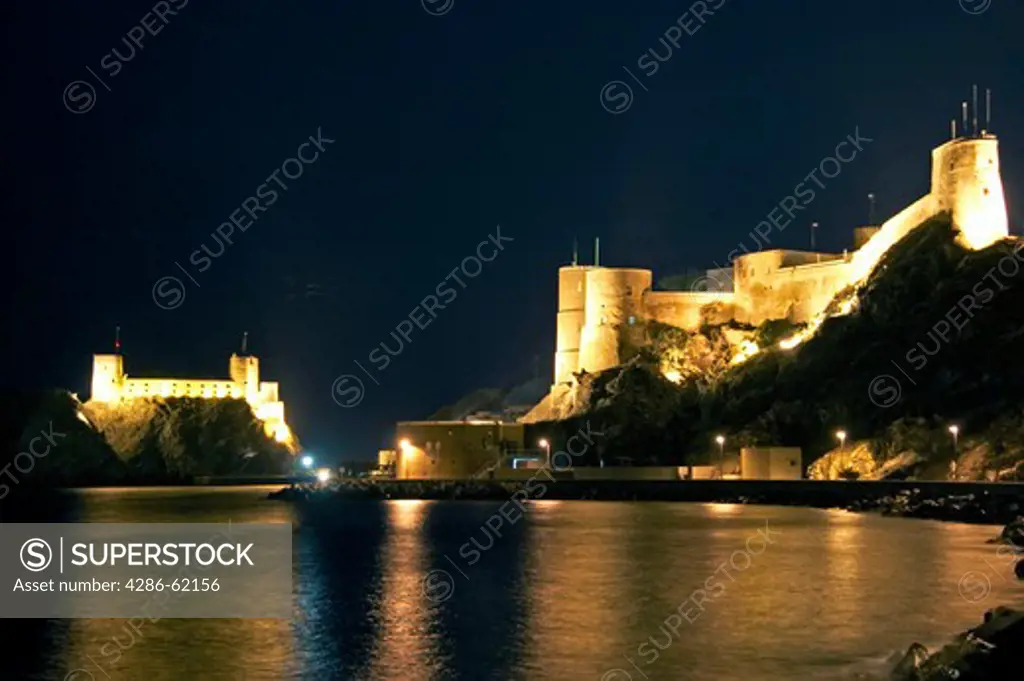 Muscatel fort of Oman Jalali and Mirani at night, fort Jalali Mirani bay in the dimmed lights