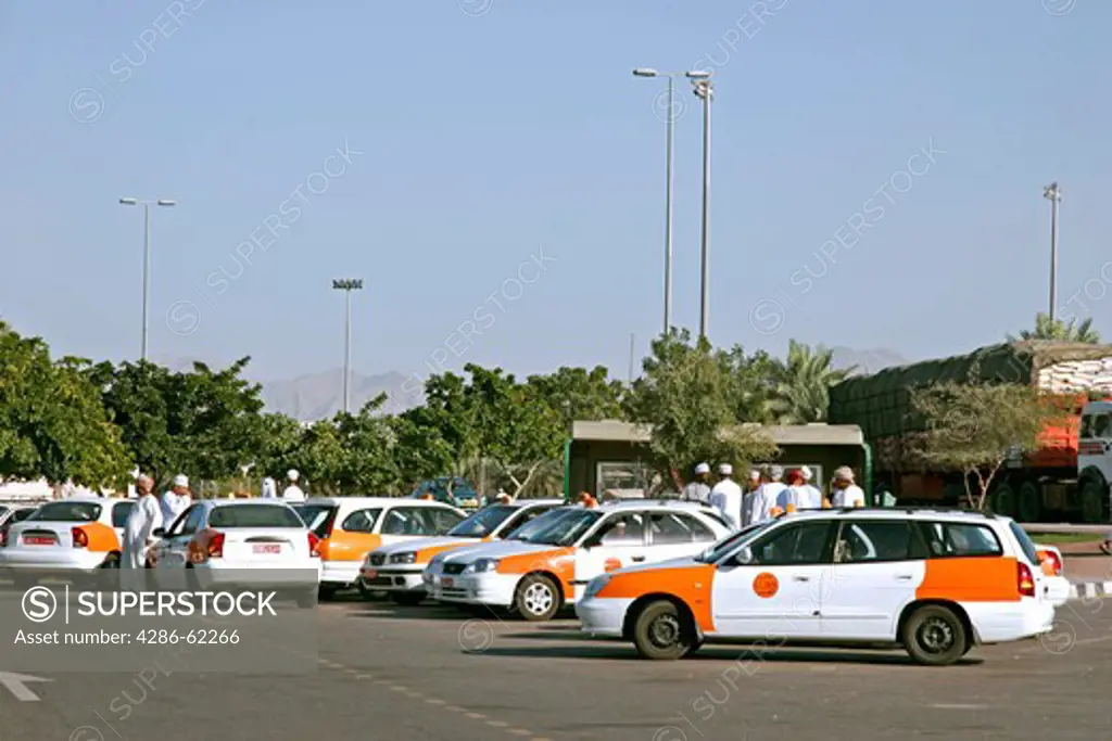 Sultanate Oman waiting taxis in the Sahwa Tower traffic of a circle. waiting taxis near Sahwa Tower