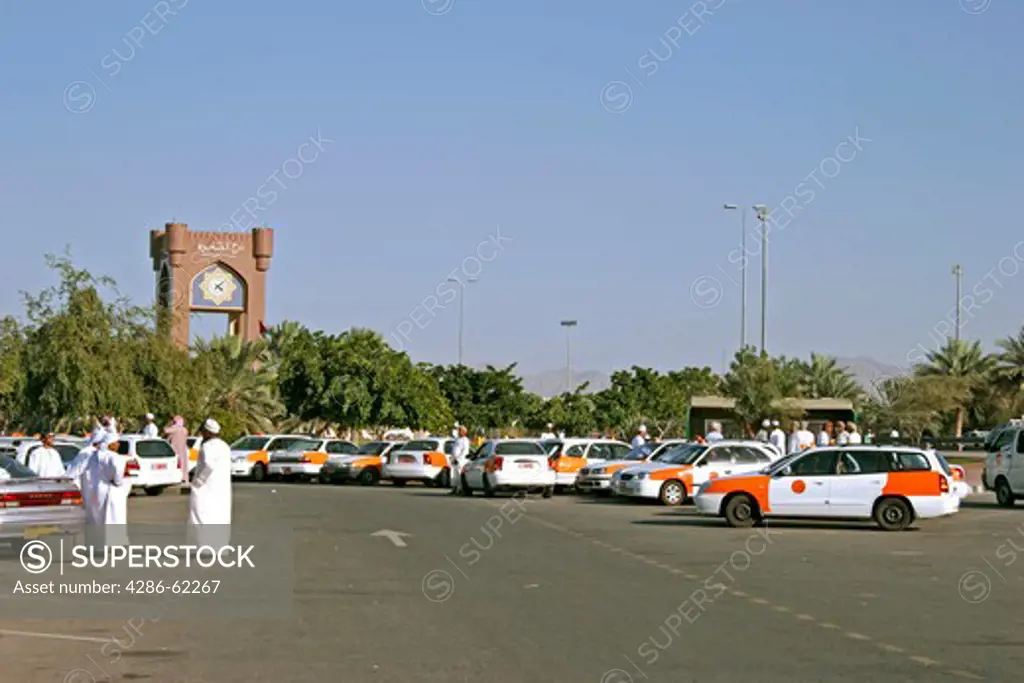 Sultanate Oman waiting taxis in the Sahwa Tower traffic of a circle. waiting taxis near Sahwa Tower