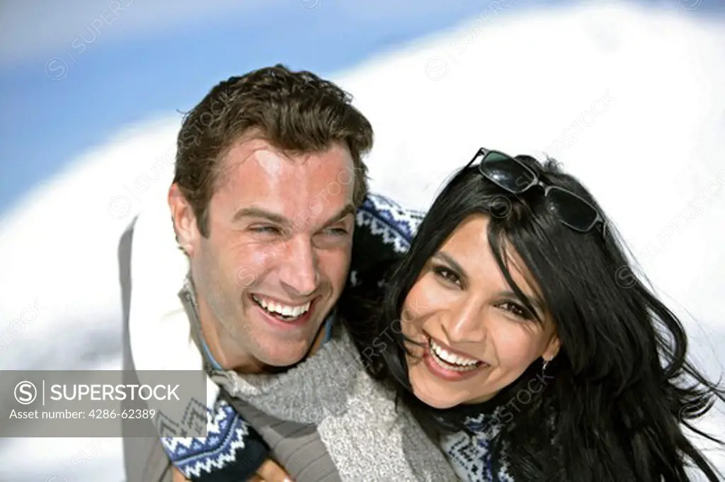 Couple in Love in Mountains Winter Holiday