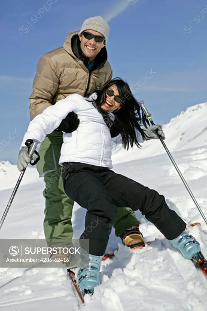 young couple having fun at winter holiday