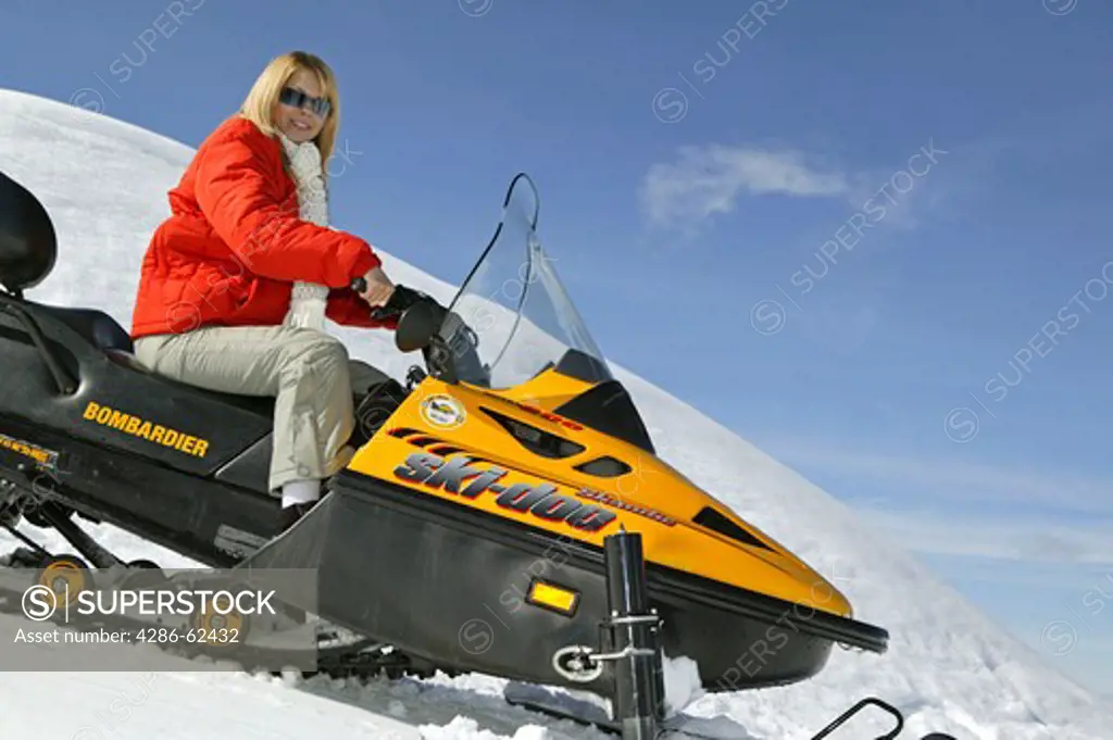 Woman on Ski Scooter Winter Holiday