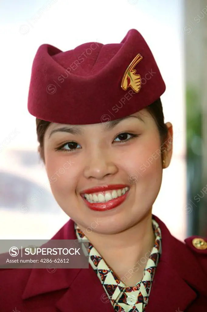 Stewardess of Qatar Airways in Uniform