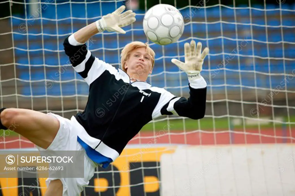 football player goalkeeper can not reach ball