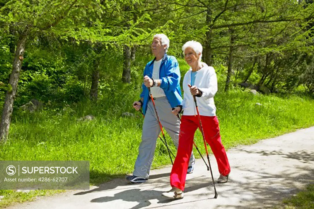 couple nordic walking seniors