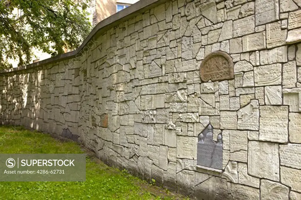Wall made of destroyed by German Nazis old Jewish tombstones in Remuh cemetery, Kazimierz, Cracow, Poland