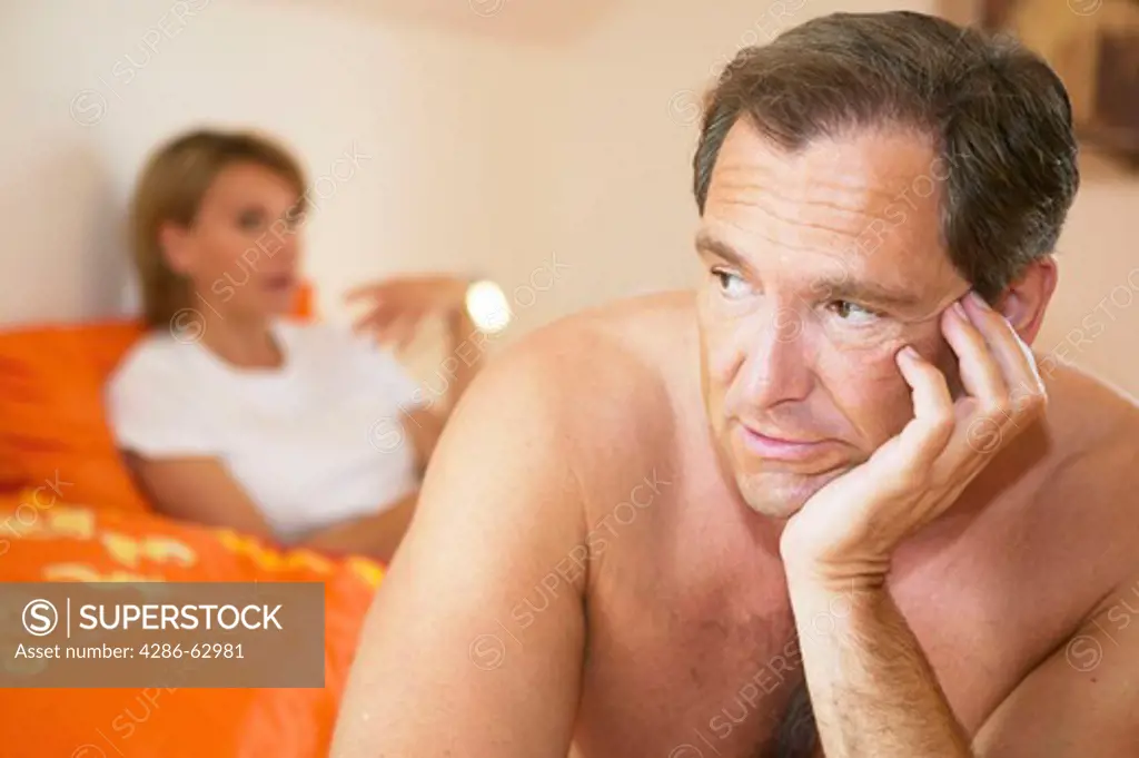 couple arguing in bed marriage crisis