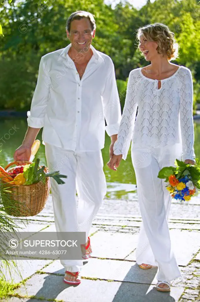 couple walking and smiling in summer