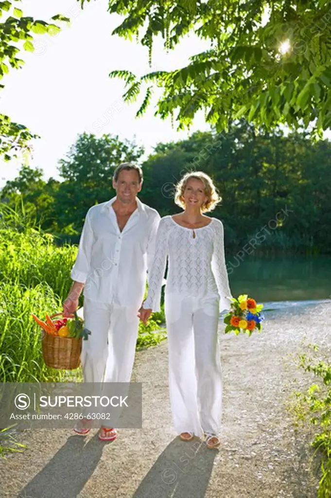couple walking and smiling in summer