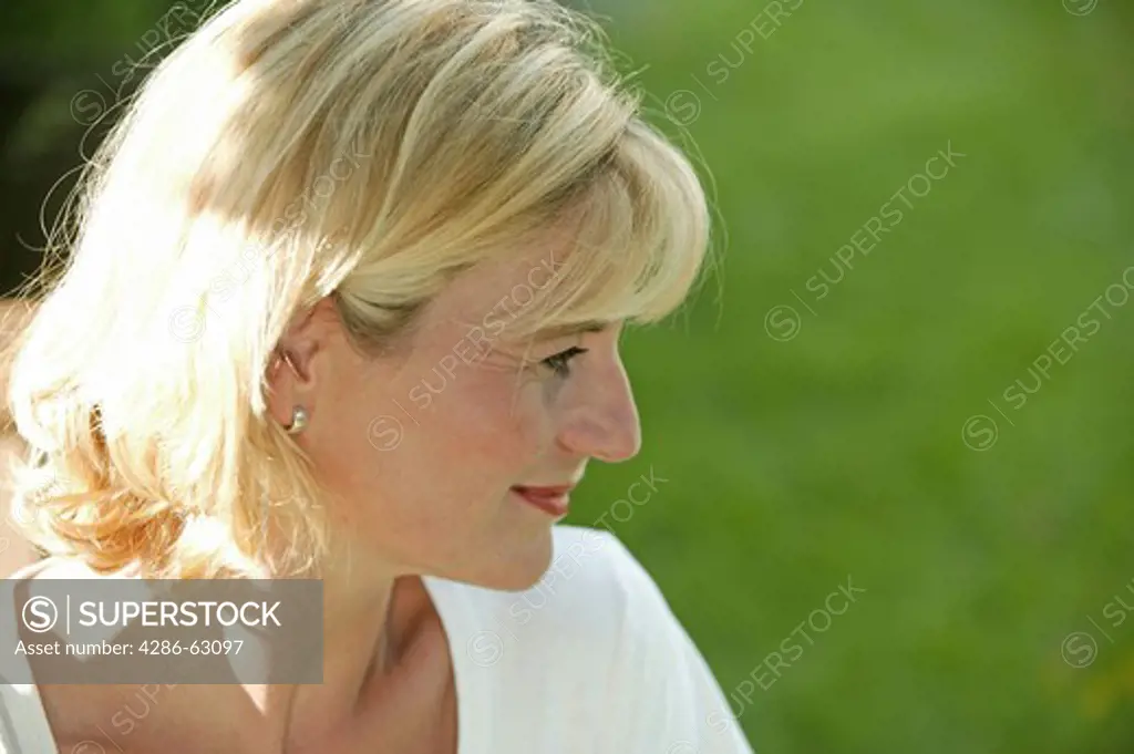 blonde woman in the garden portrait