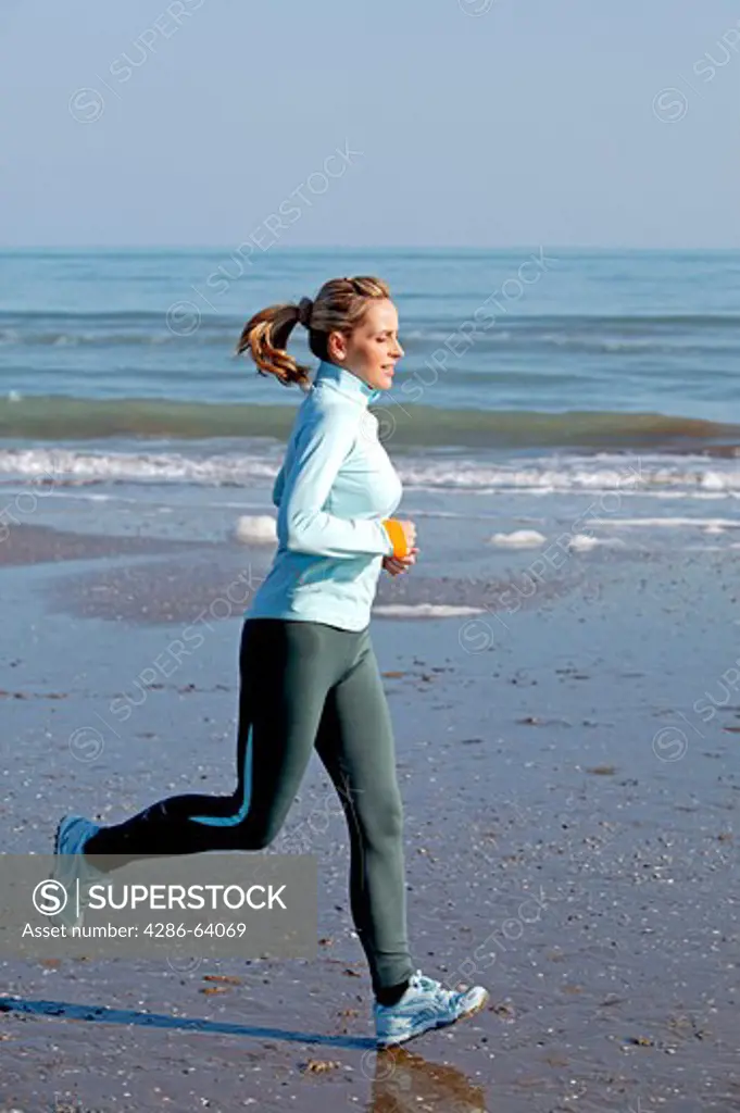 woman jogging at the sea