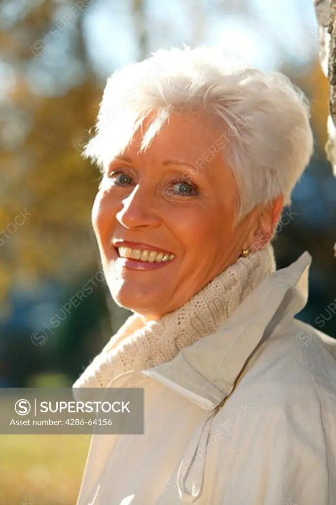 older woman in autumn