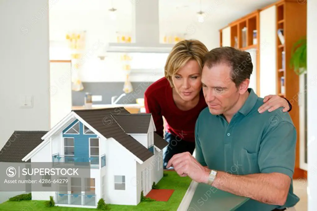 couple with house model