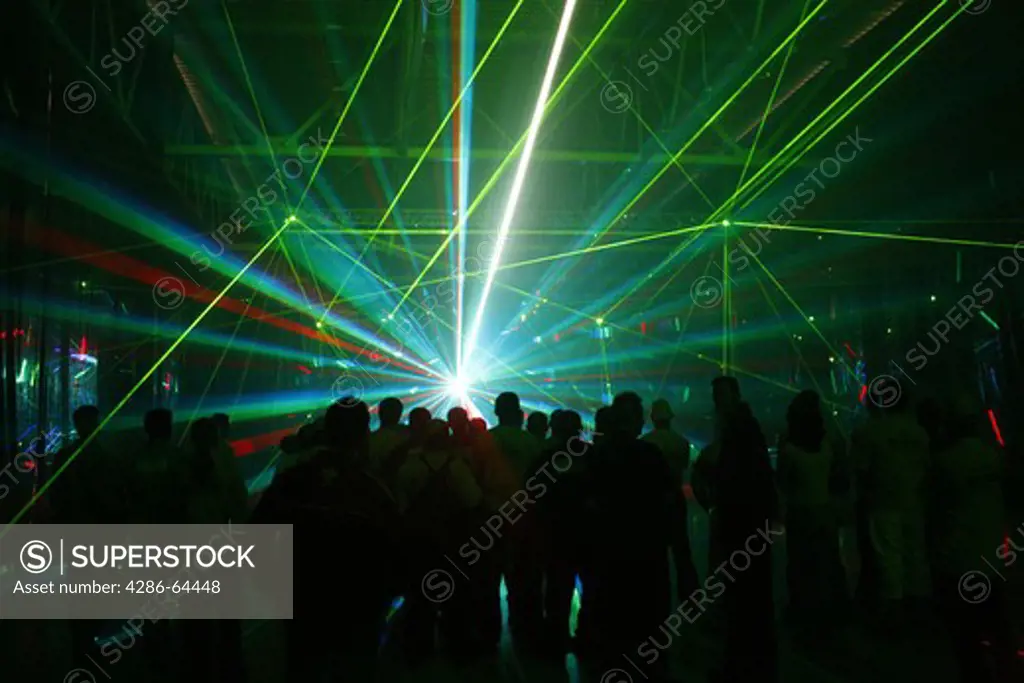 Laser show with coloured light at night