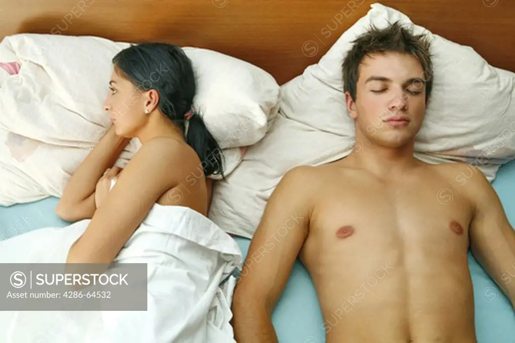 Young couple has problems in the bed