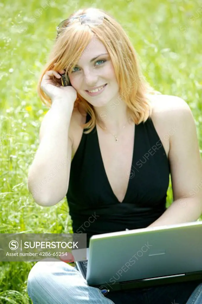 woman with computer outdoors