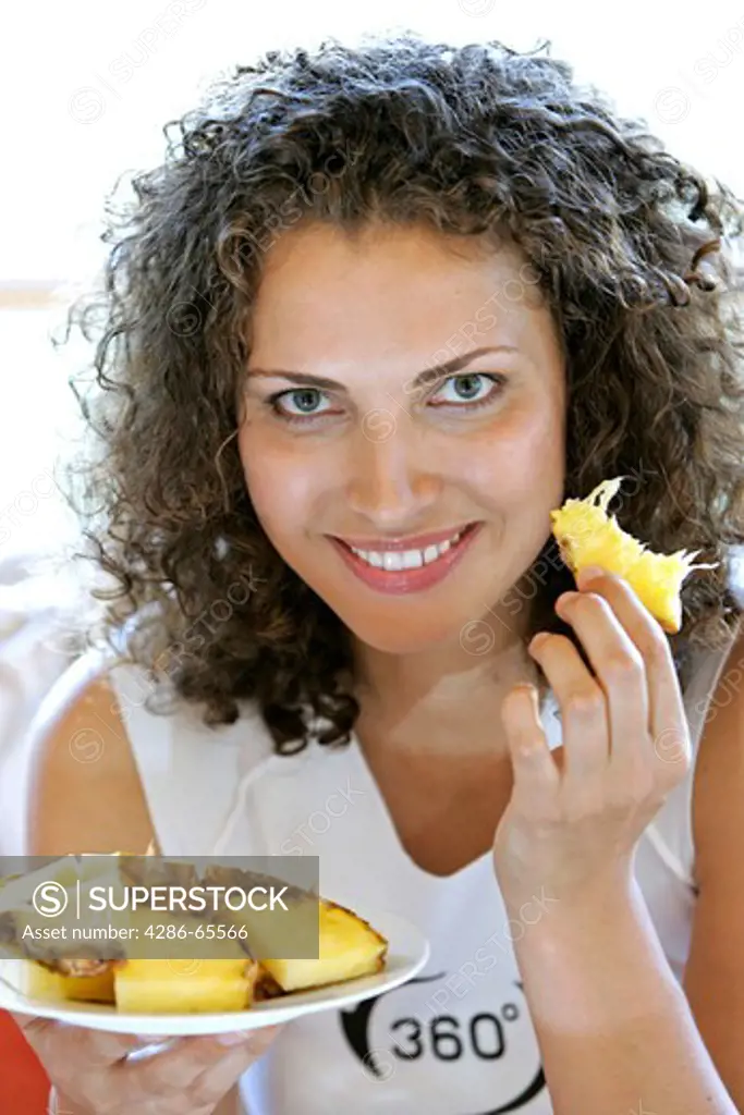 Woman eats fruit