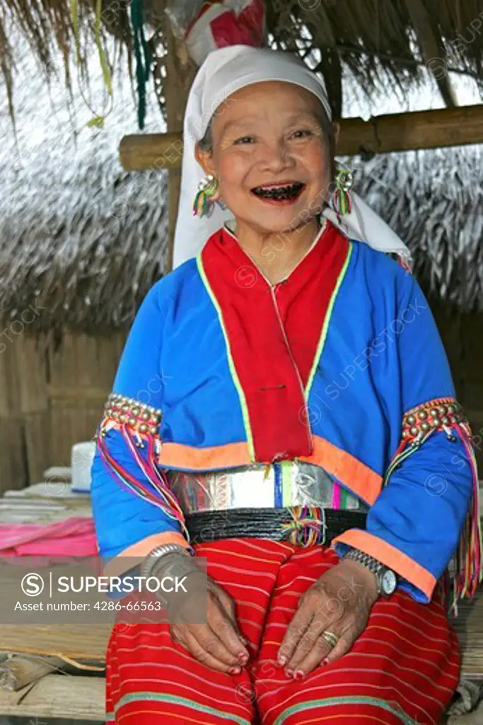 Beautiful old woman of the Black Karen tribe The black teeth have been caused by constant chewing of betelnut Chiang Rai regio