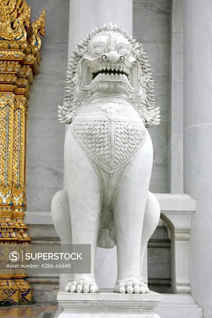 Marble lion or 'Singha' guarding Marble Temple, Wat Benchanmabophit, Bangkok  Asia
