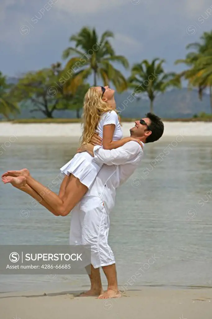 couple in love have fun at tropical beach in