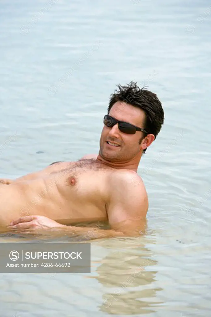Man relax at tropical beach in
