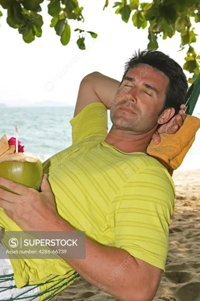 Man relax in Hammock at yao yai island resort