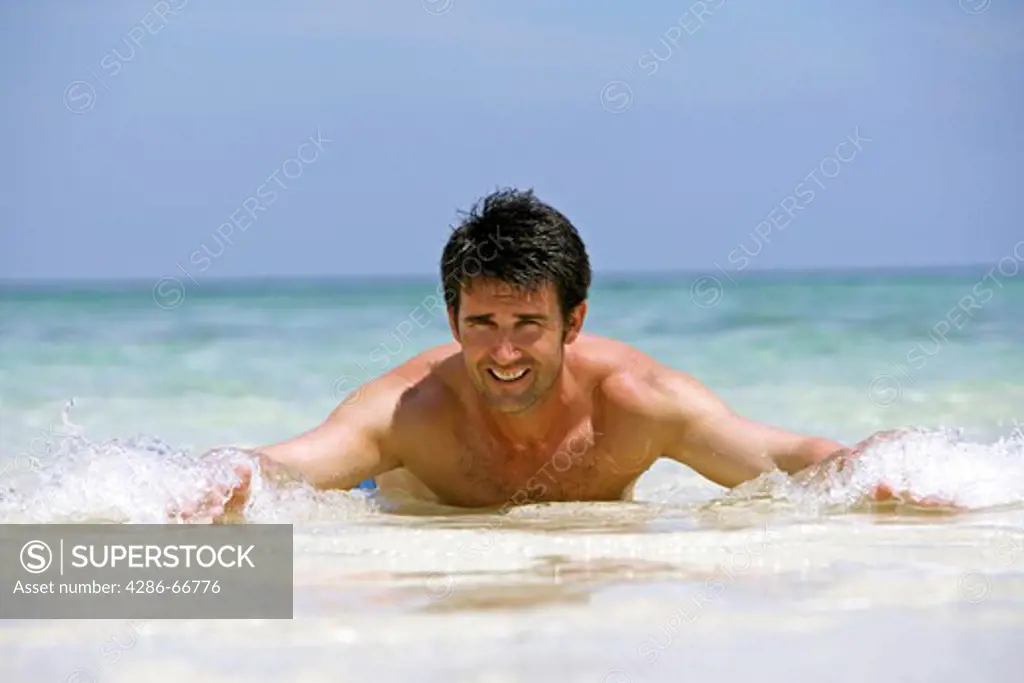 Man enjoying holiday at tropical beach in  Krabi