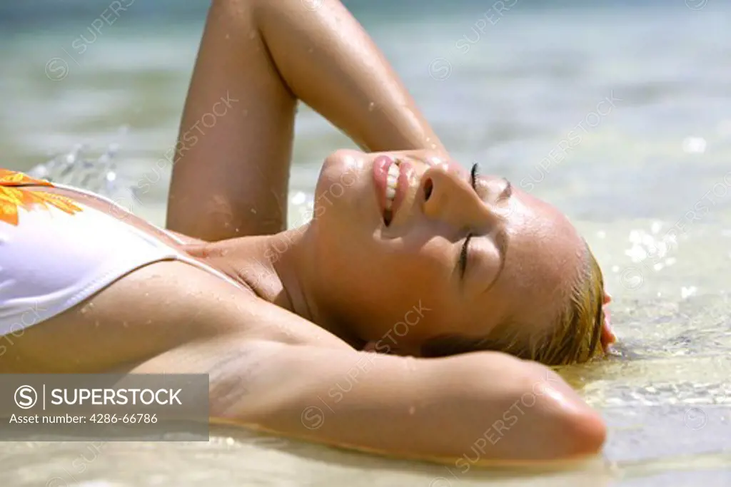 beauty blond woman relax at tropical beach in  Krabi