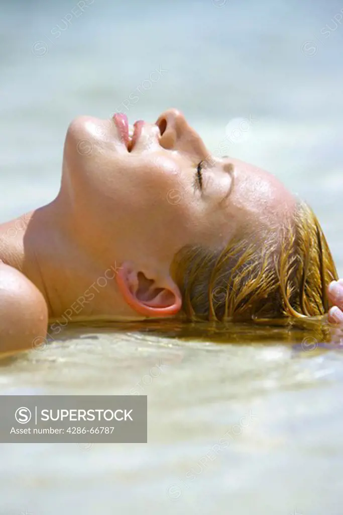 beauty blond woman relax at tropical beach in  Krabi