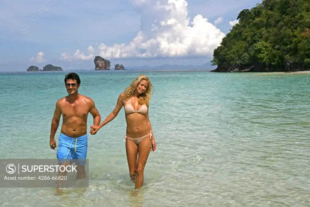 couple in love enjoy summer holidays at tropical beach in