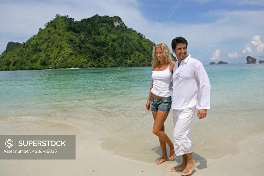 couple in love enjoy holiday on tropical beach in