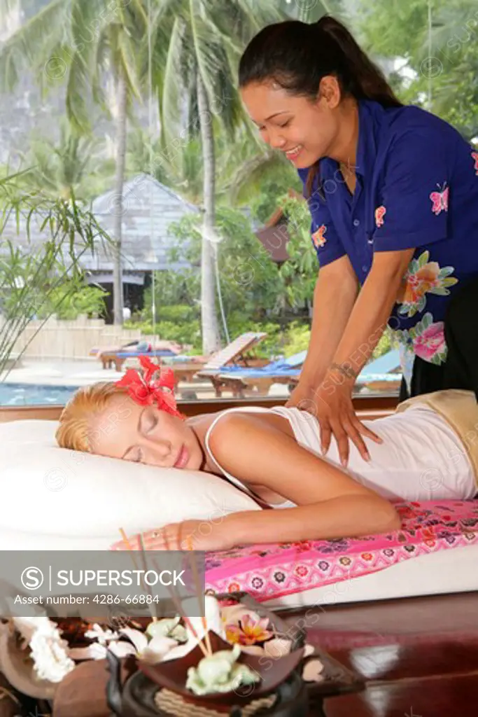 young woman enyoing thai massage