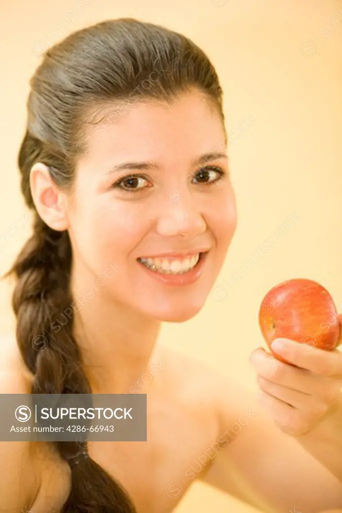 Woman, young, smile, apple, eat, portrait, (model release)