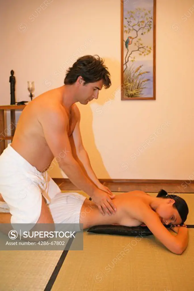 woman enjoying massage from her man, boyfriend