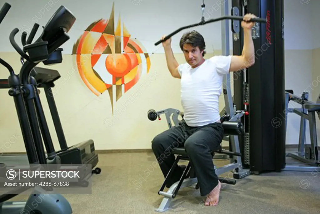 man working out at the gym of a vital hotel