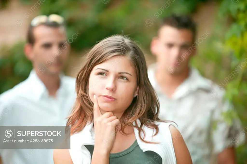 young woman incertain between two men