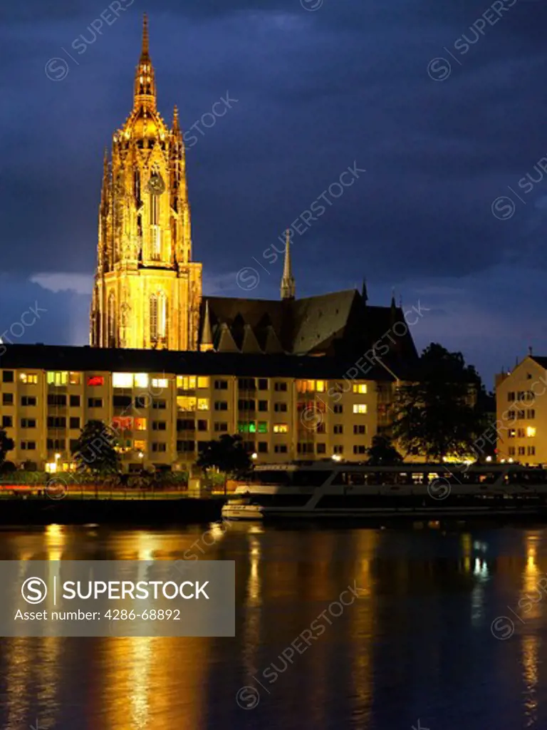 View of the Frankfurter Dom cathedral in Frankfurt Germany looking across the River Main at night