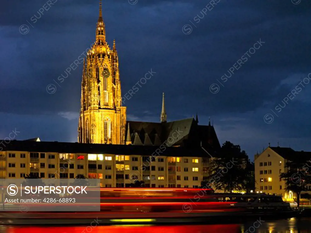View of the Frankfurter Dom cathedral in Frankfurt Germany looking across the River Main at night