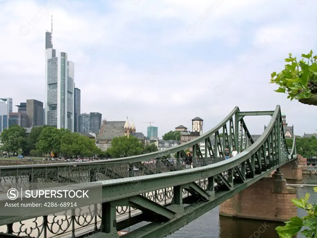 Iron footbridge and skyline in Frankfurt am Main