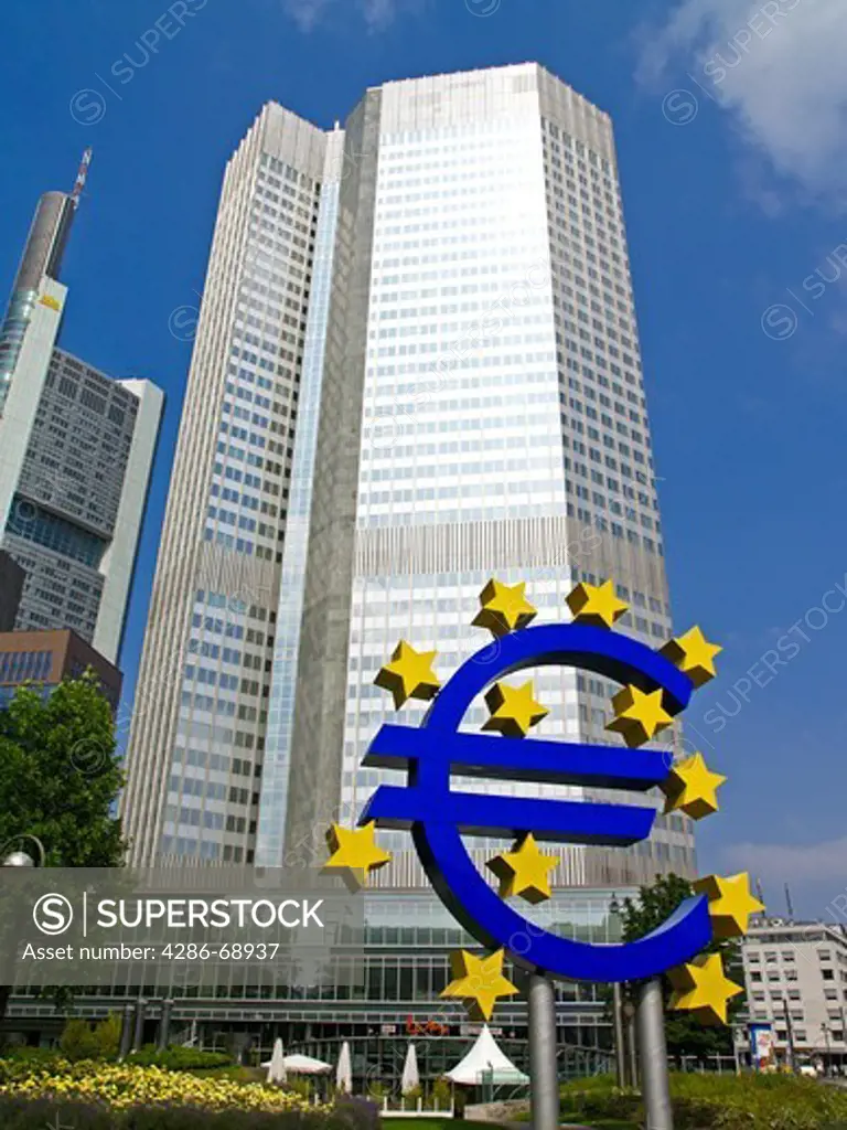 Euro Symbol in foreground of the European Central Bank in Frankurt Germany